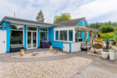 Wohnzimmer und Terrasse - Mit Einbauküche, Carport, überdachter Terrasse u.v.m.: Modularer Bungalow in Altlandsberg Bruchmühle